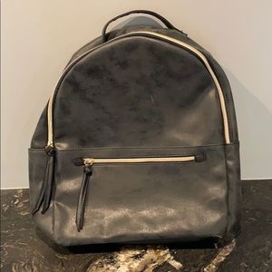 Leather bag with gold zippers